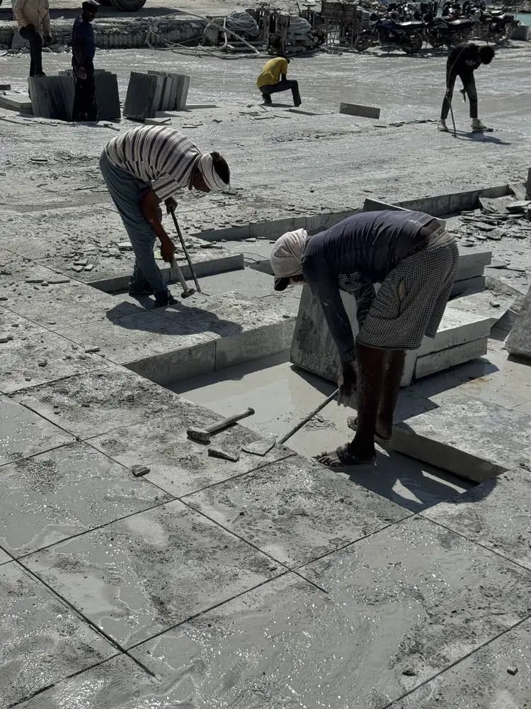 Workers lifting slabs from the quarry bed